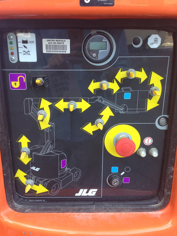 The control panel of a cherry picker crane